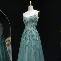 Floor-length A-line tulle gown with open-back detail and slim straps