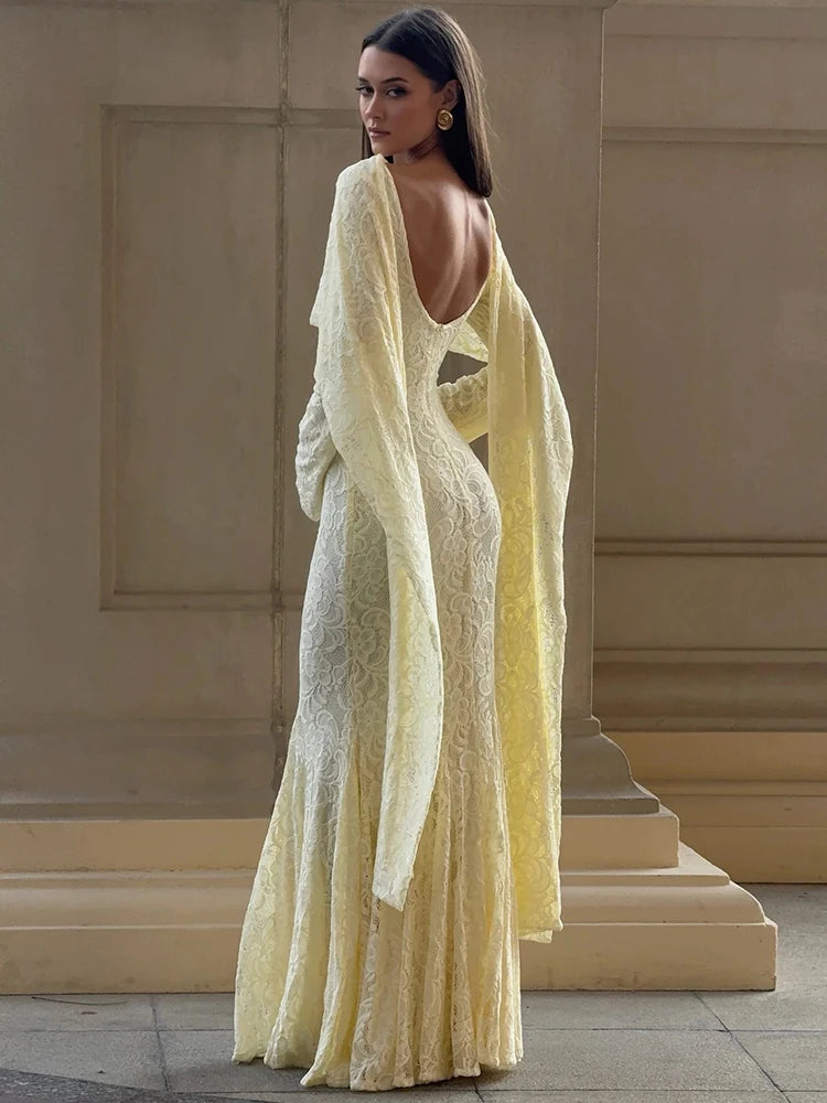 Close view highlighting the square neckline and ruched detailing across the bodice.