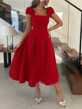 Red square-neck midi dress with puff sleeves and a pleated skirt