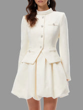 A-line mini dress featuring sculpted hem and stand collar styled against a soft background