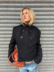 Short coat showing the neckline and clean outerwear finish