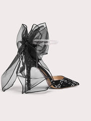 Statement black bow heels for women designed for evening events and parties