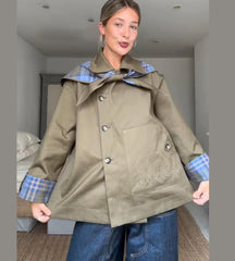 Statement checked jacket for women paired with mini skirt indoors