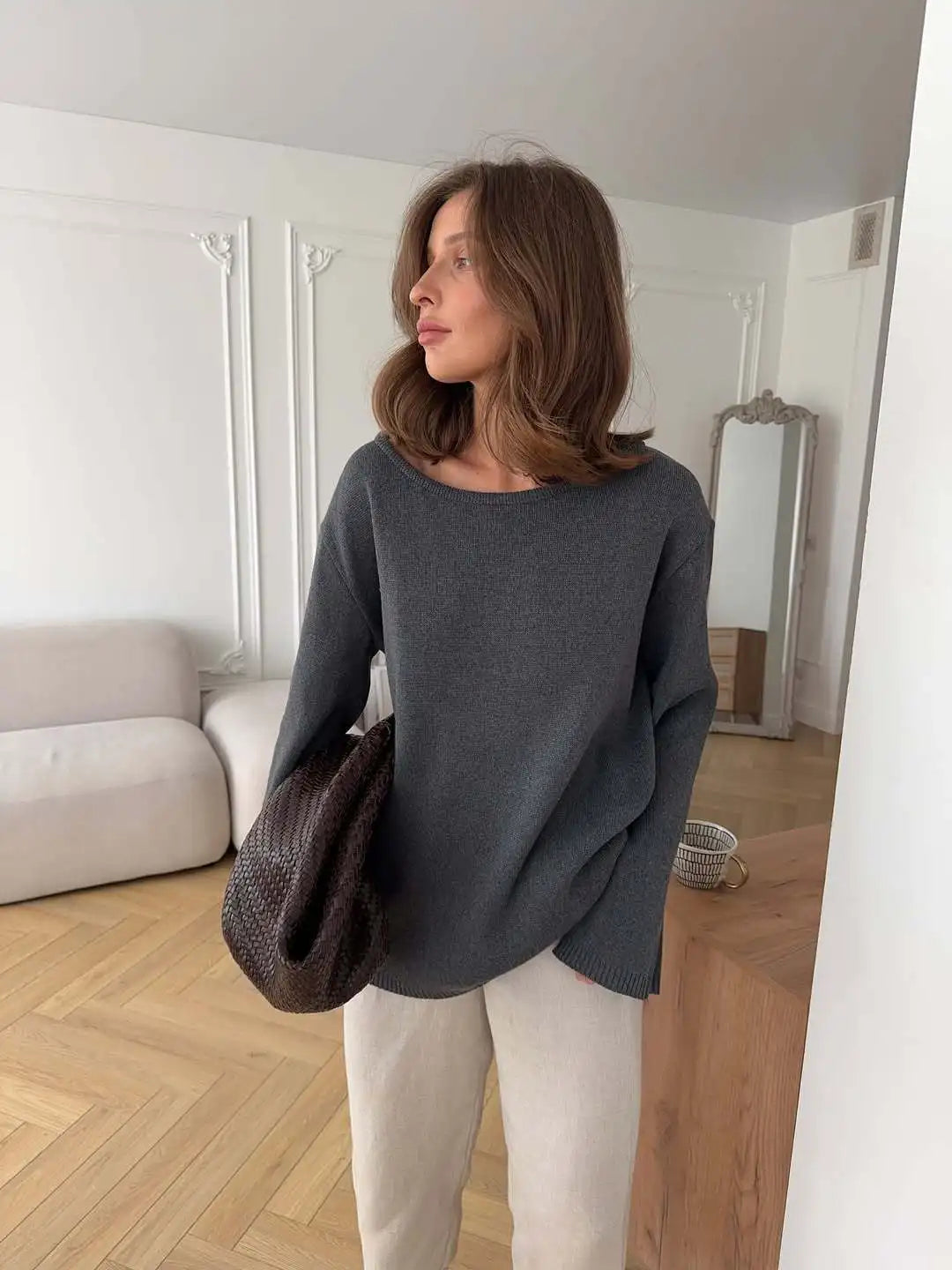 Statement knit sweater for parties and gallery nights with a modern drape