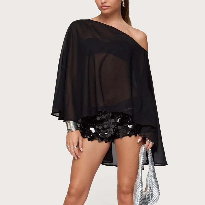 Statement black blouse showing urban streetwear layering style