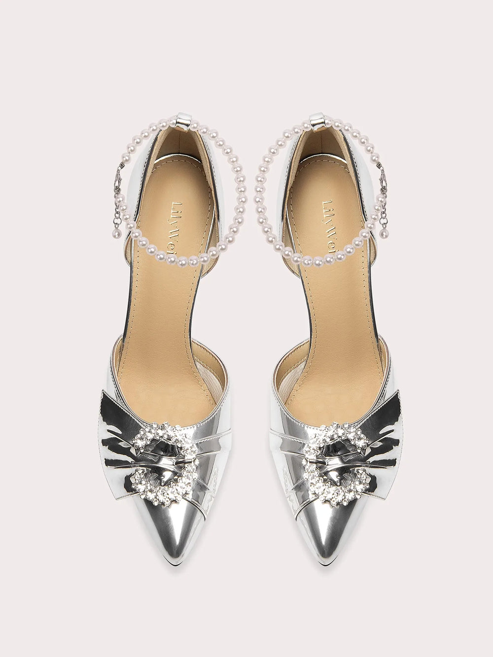 Silver wedding guest shoes with beaded ankle strap and pointed toe