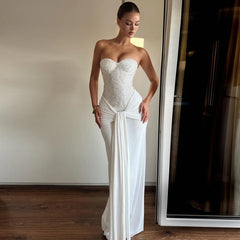 Elegant white maxi dress perfect for statement summer celebrations