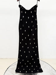 Front view highlighting the cropped blazer proportions over the long dress, creating a structured waistline and clean, tailored presence.