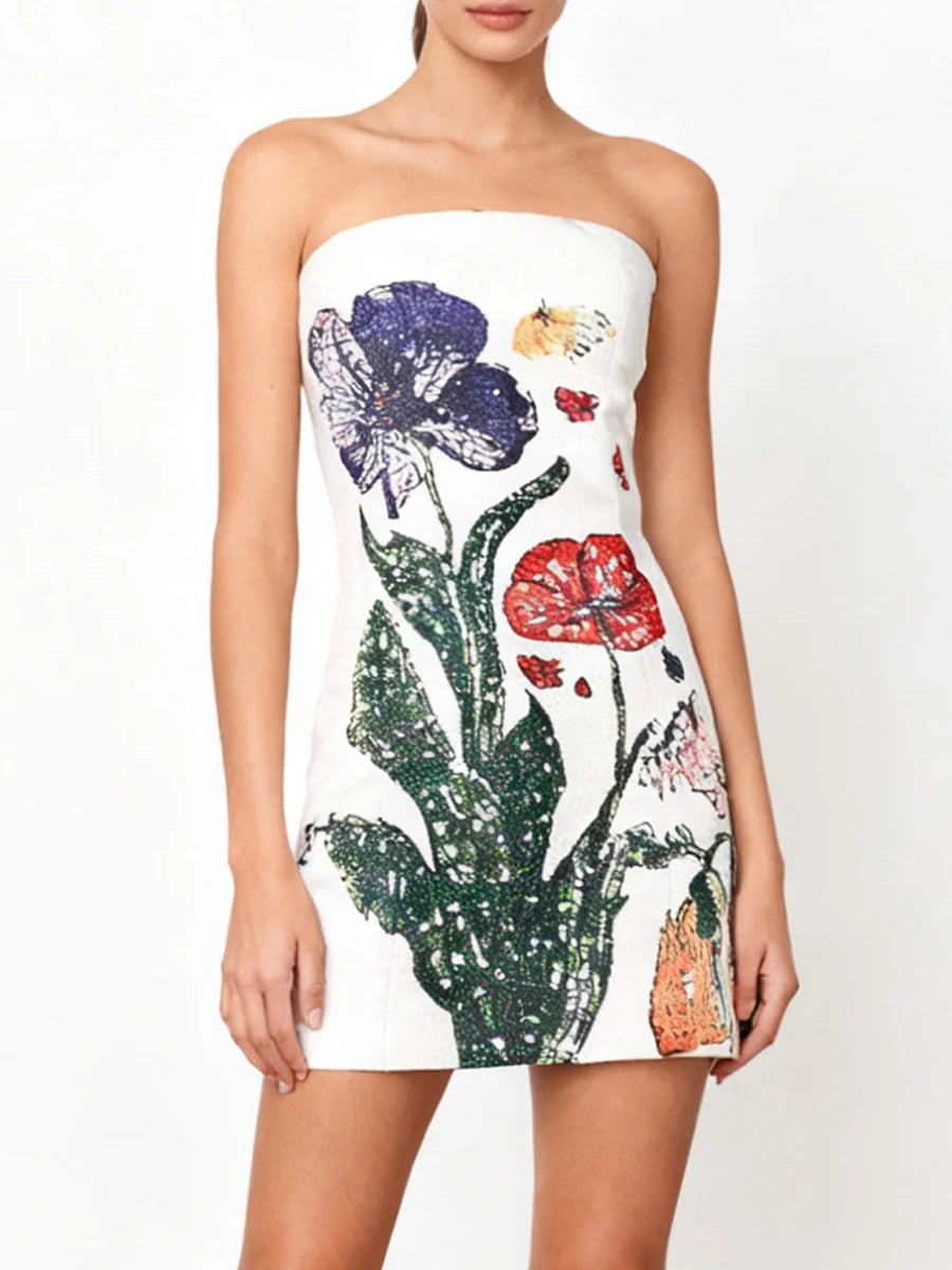 Model wearing a strapless white mini dress with bold floral beadwork