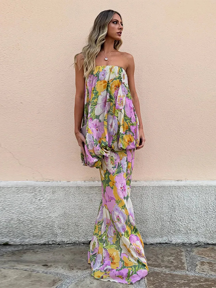model wearing strapless pastel floral maxi dress outdoors