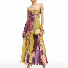 Front view of woman in strapless boho floral maxi dress with matching clutch