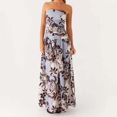 Woman in a floral strapless maxi dress styled for summer events