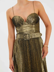 Close-up view of a strapless gold maxi dress with a fitted waistline.