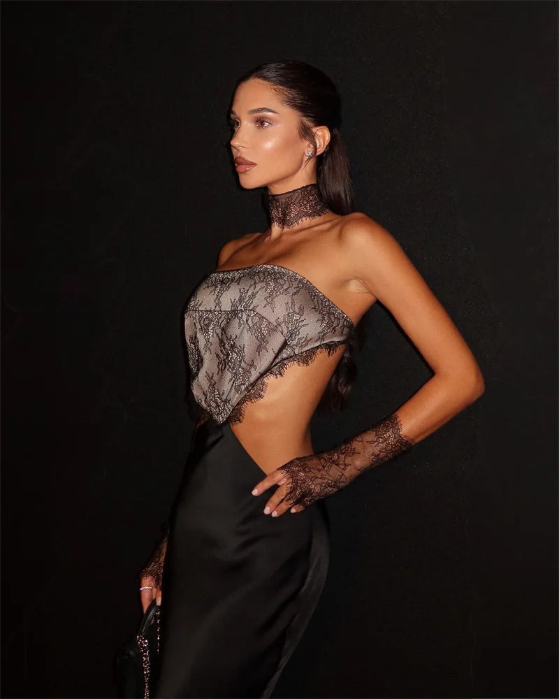 Close-up showing the lace bodice texture and structured shaping that defines the upper silhouette.