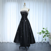 Black strapless satin A-line gown with crystal beading at the neckline