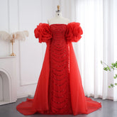 Deep red strapless sequin mermaid gown with dramatic floral cape