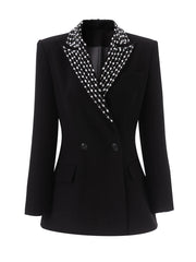 Structured black blazer styled with patterned collar