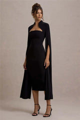 Refined black midi dress designed with dramatic cape flow