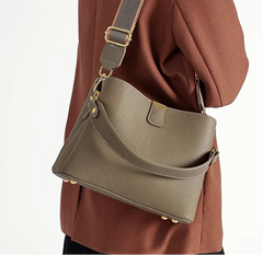 Soft structured leather satchel featuring a single strap and clean silhouette