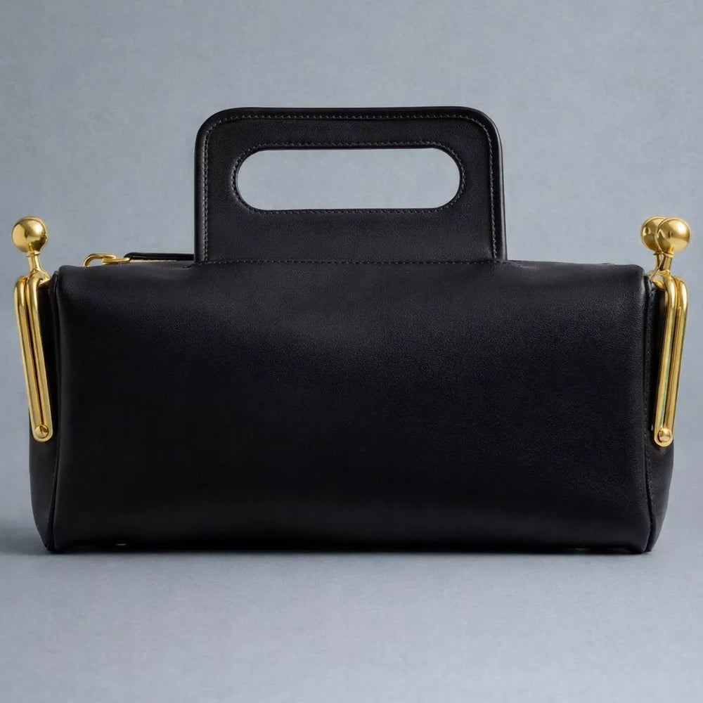 minimalist structured shoulder bag with clean edges and metallic accents