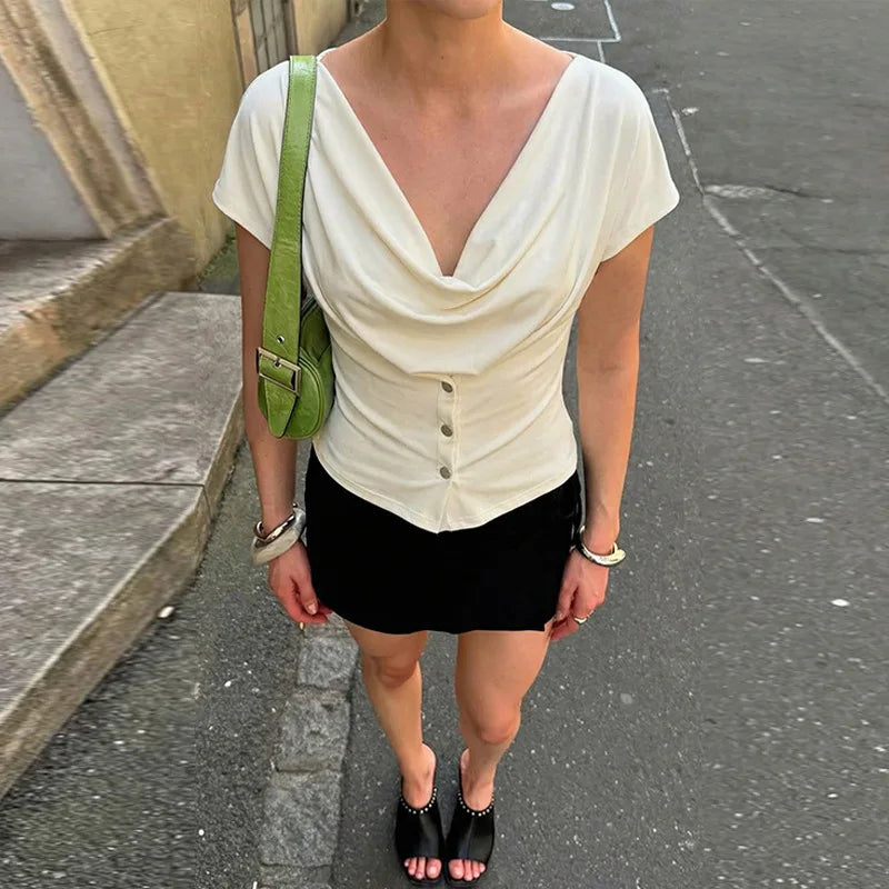 Structured off-shoulder blouse with subtle pleating through the bodice