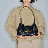 structured hobo shoulder bag with curved silhouette and single strap