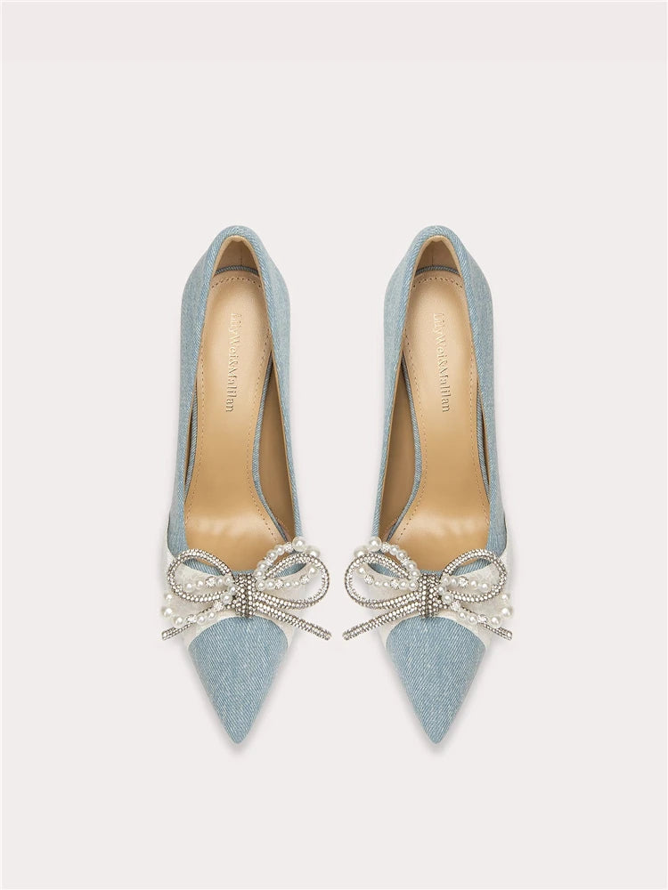 Suede pointed toe pumps with pearl bow design