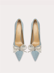 Suede pointed toe pumps with pearl bow design