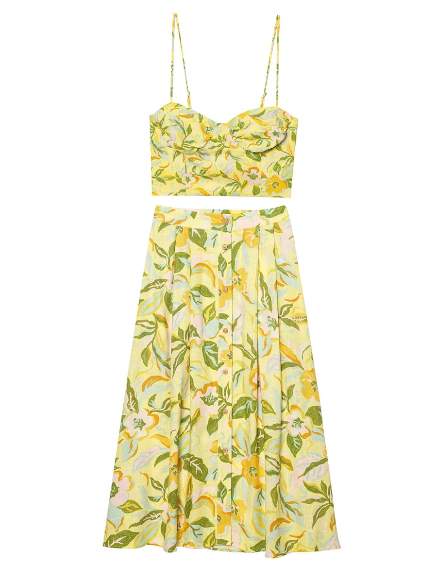 Coordinated summer outfit with maxi skirt and crop top on a white background