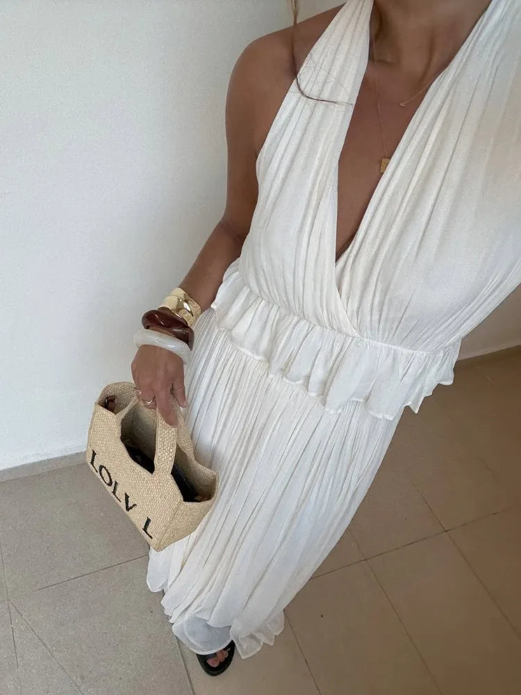 Backless white crop top and flowy skirt for formal beach moments