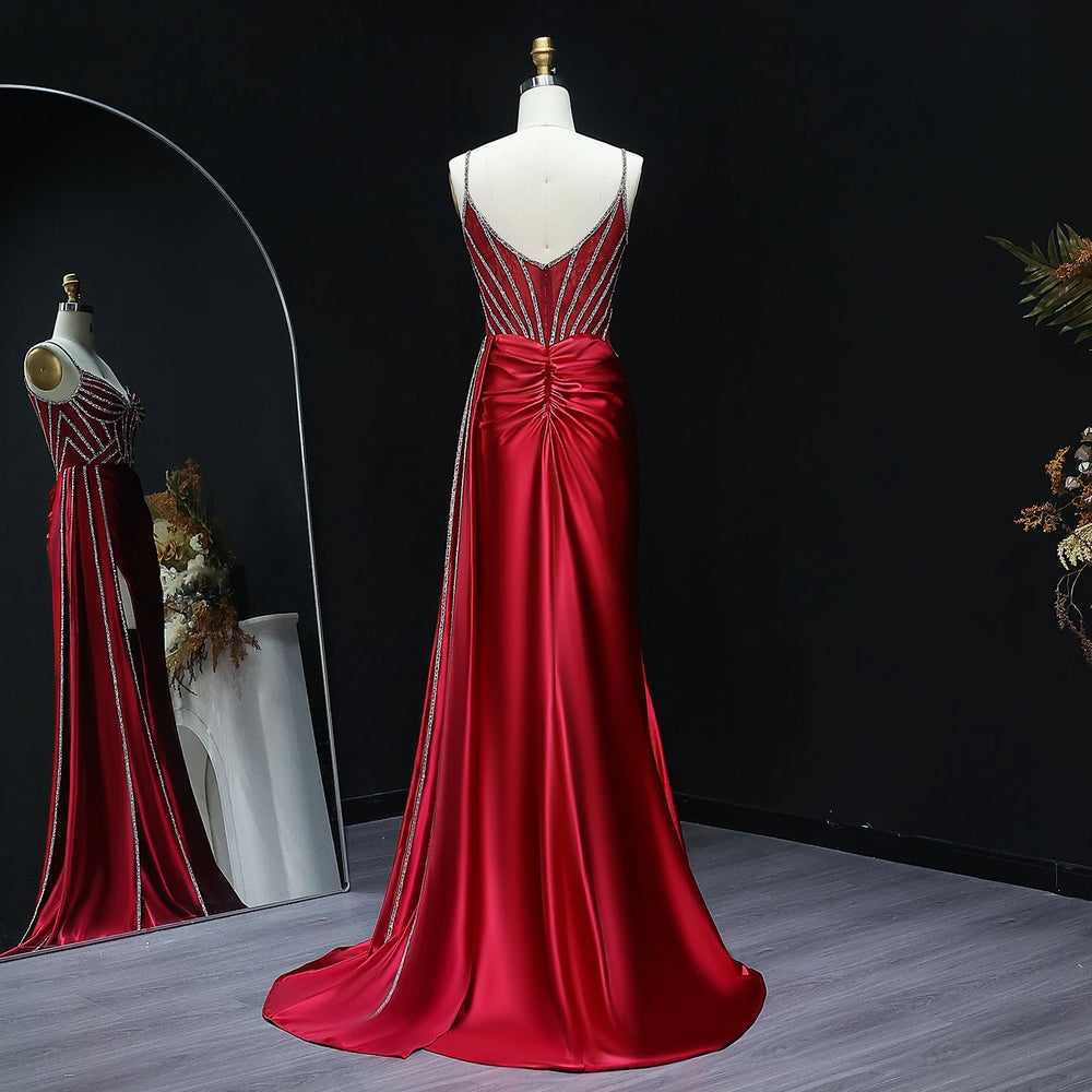 Sweep train detail on satin mermaid prom gown with fitted silhouette