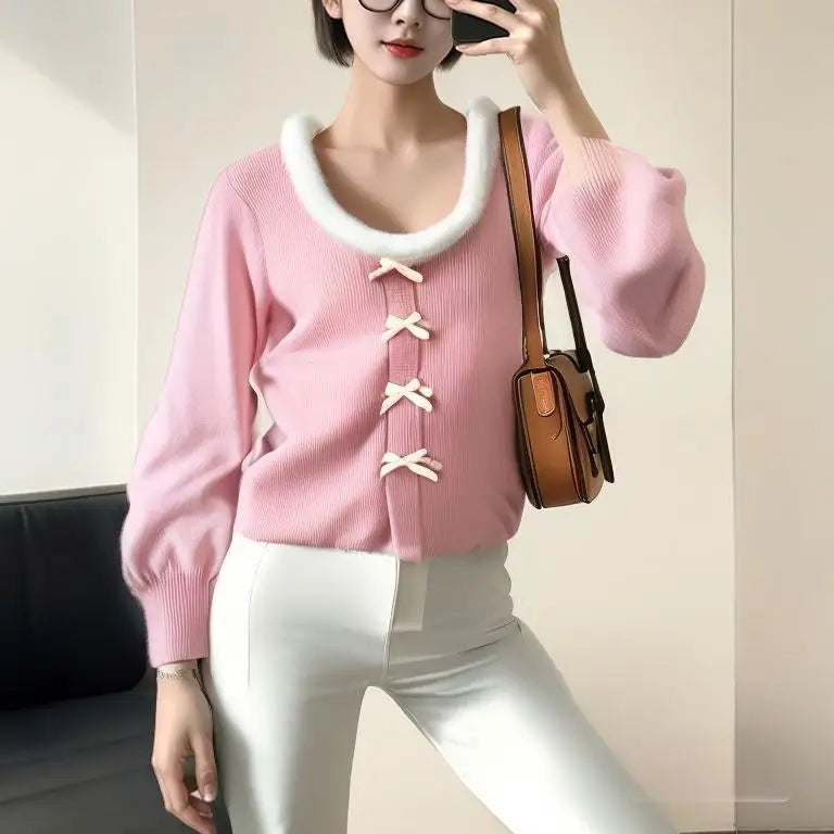 The slim fit of the knit top, highlighting its flattering silhouette.