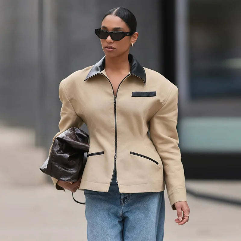 Close-up of contrast collar and zip-front detailing on cotton jacket