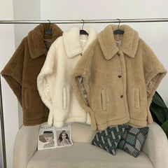 Studio interior image of a wool teddy coat styled casually, showcasing its soft structure and everyday appeal