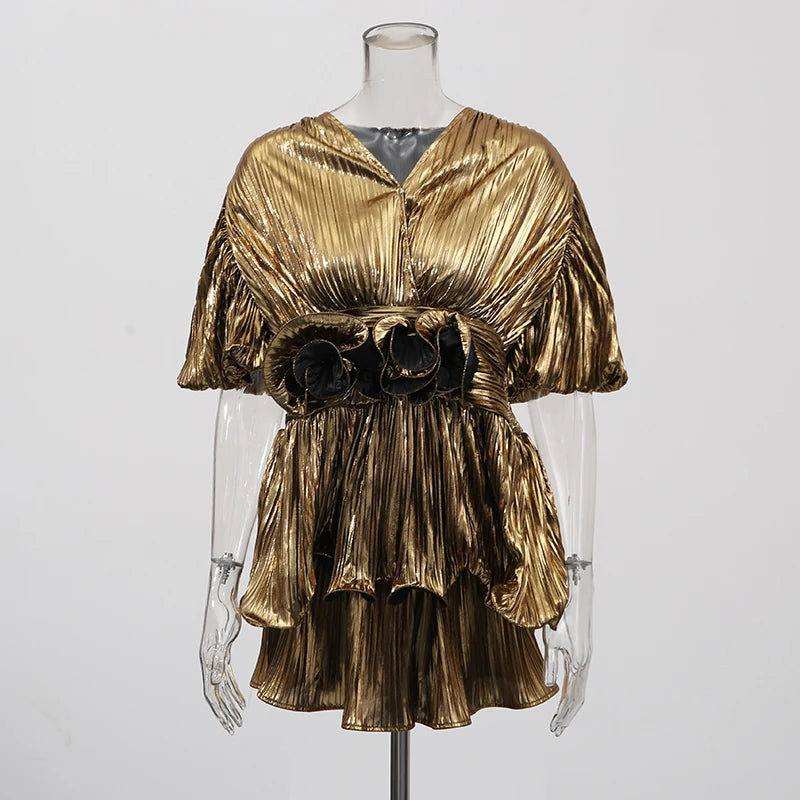 Close-up of the gold co-ord top highlighting the three-dimensional floral texture and soft woven fabric.