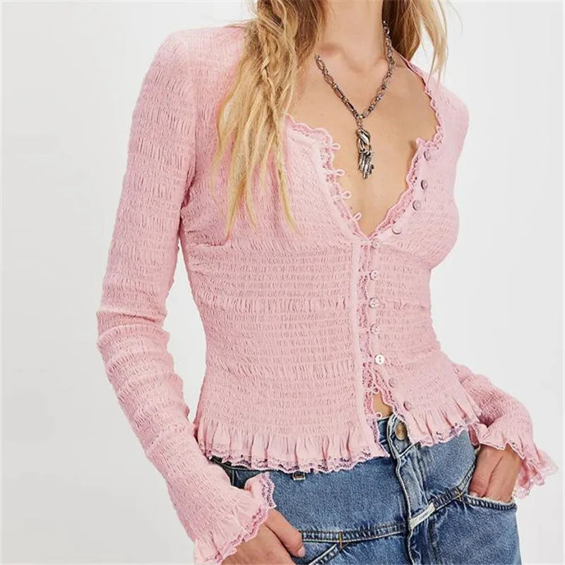 Textured red knit cardigan paired with jeans for a cozy fall style