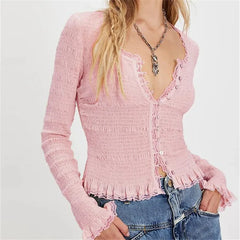 Textured red knit cardigan paired with jeans for a cozy fall style