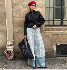 Detail shot focusing on the jacket’s tonal braid texture and seams, with sunlight emphasizing the structured weave and front panel design.