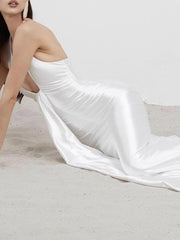 Trumpet silhouette white gala gown modeled at formal celebration