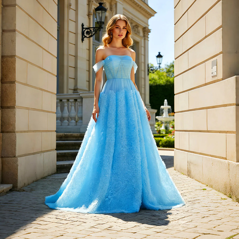 Off-shoulder neckline on a tulle evening gown with built-in bra support and natural waist
