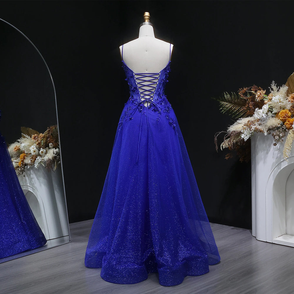 Close-up of floral appliqué bodice detailing on layered tulle gown