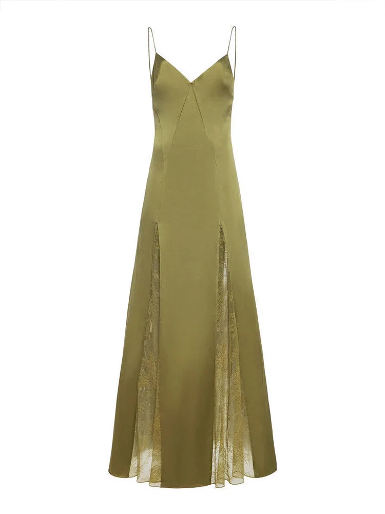 Close-up of V-neckline and lace detailing on green party dress