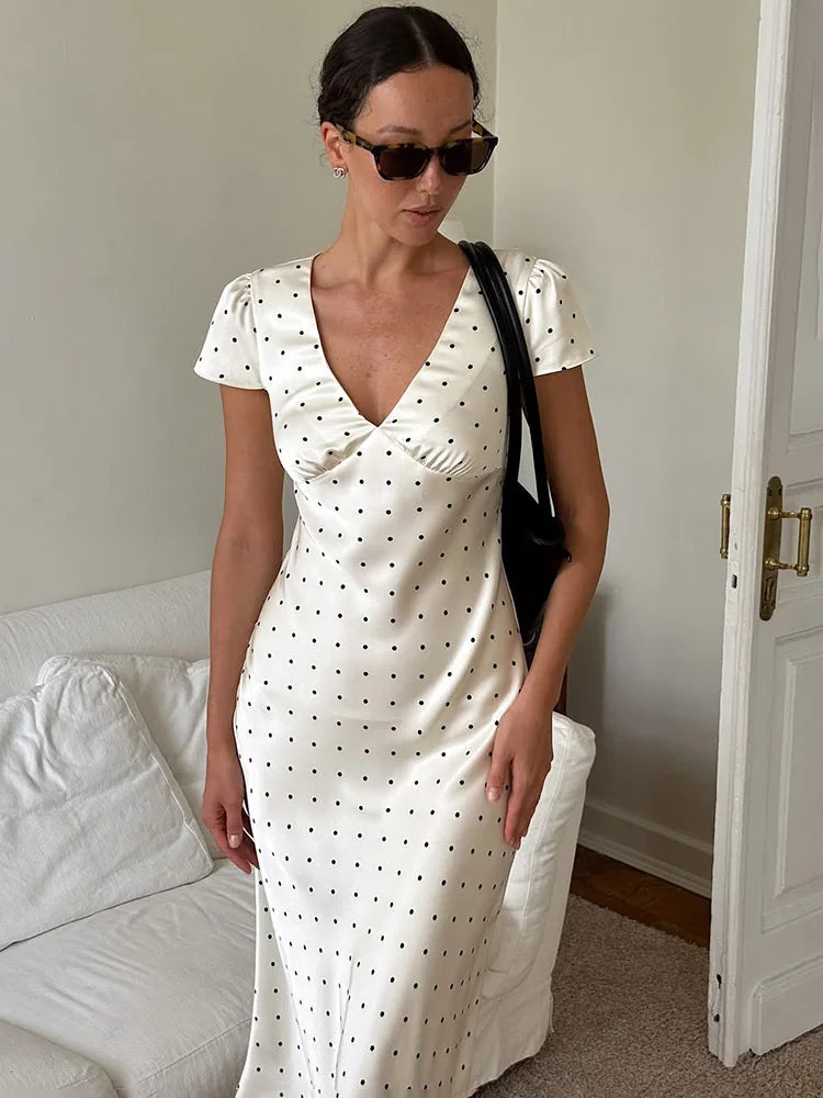 A close-up of the elegant floral print and the smooth texture of the satin fabric.