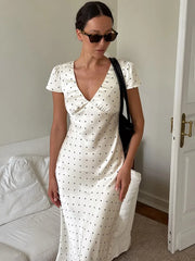 A close-up of the elegant floral print and the smooth texture of the satin fabric.