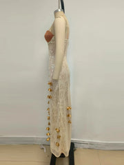 A close-up of the V-neck and sequin lace detail on the dress.