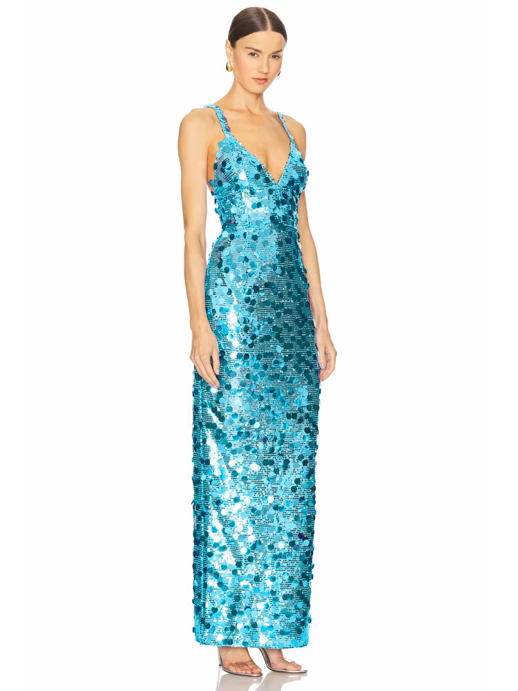Close-up of the blue sequin dress highlighting the V-neckline, strap placement, and reflective texture.