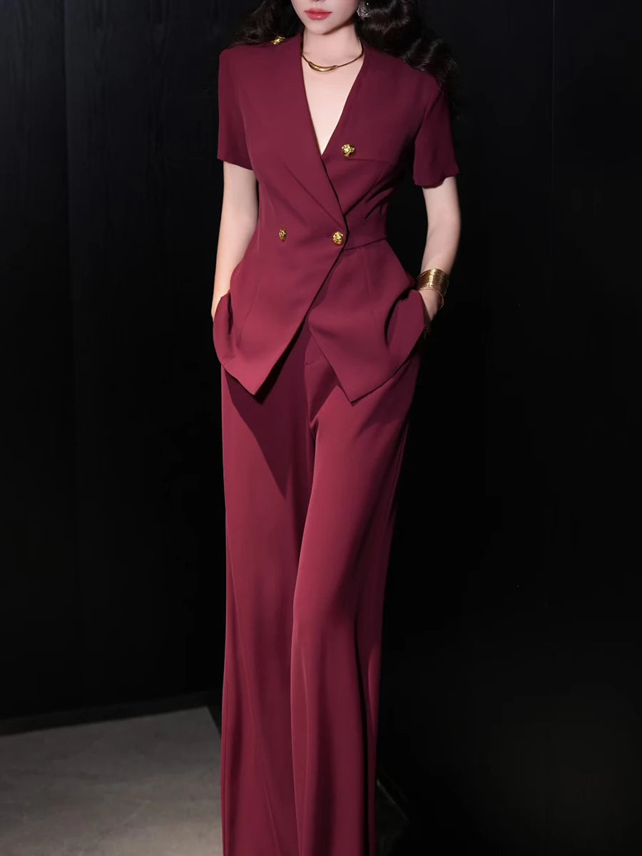 A front view of a V-neck top and high-waist pants, highlighting the slim silhouette.