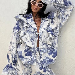 Person wearing a matching women’s vacation outfit styled with gold accessories white background