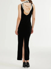 Elegant sleeveless black evening gown styled for formal events