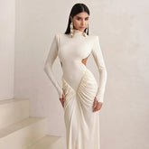 White cutout turtleneck knit gown designed for winter parties